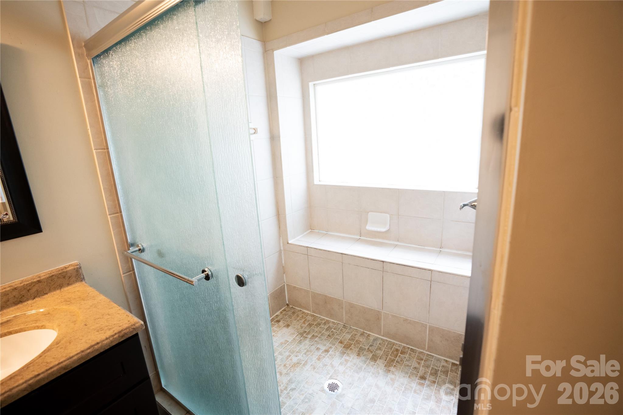 10737 Spruce Mountain Road Charlotte, NC 28214 - Photo 7 of 19 a bathroom with a bathtub