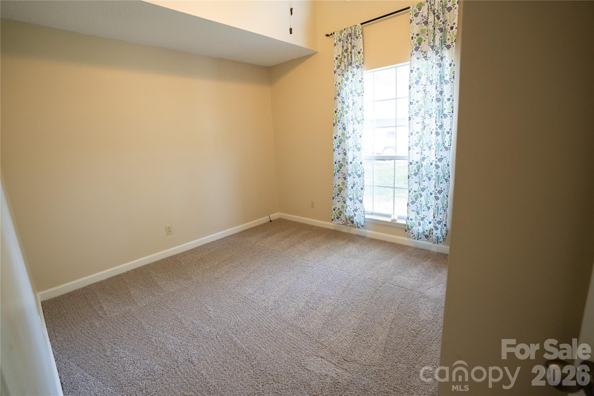 10737 Spruce Mountain Road Charlotte, NC 28214 - Photo 10 of 19 a view of a room that has a window in it