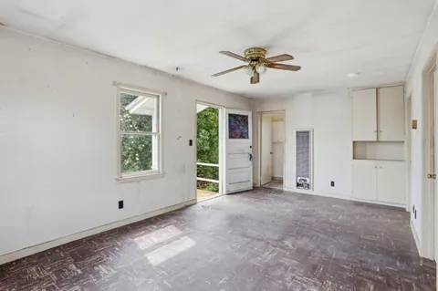 a view of empty room with wooden walls