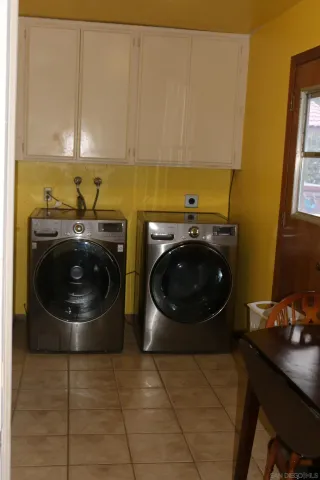 a view of a utility room with dryer and washer