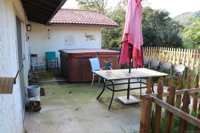 a patio with table and chairs
