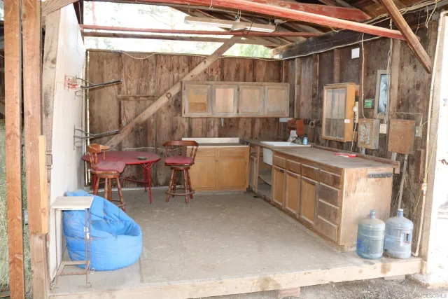 a room with a wooden furniture and a table