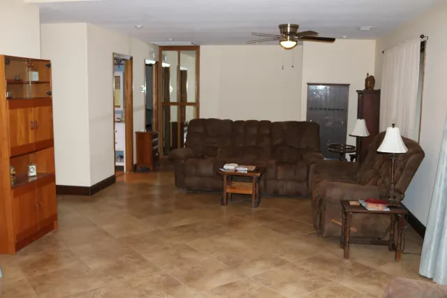 a living room with furniture and a window