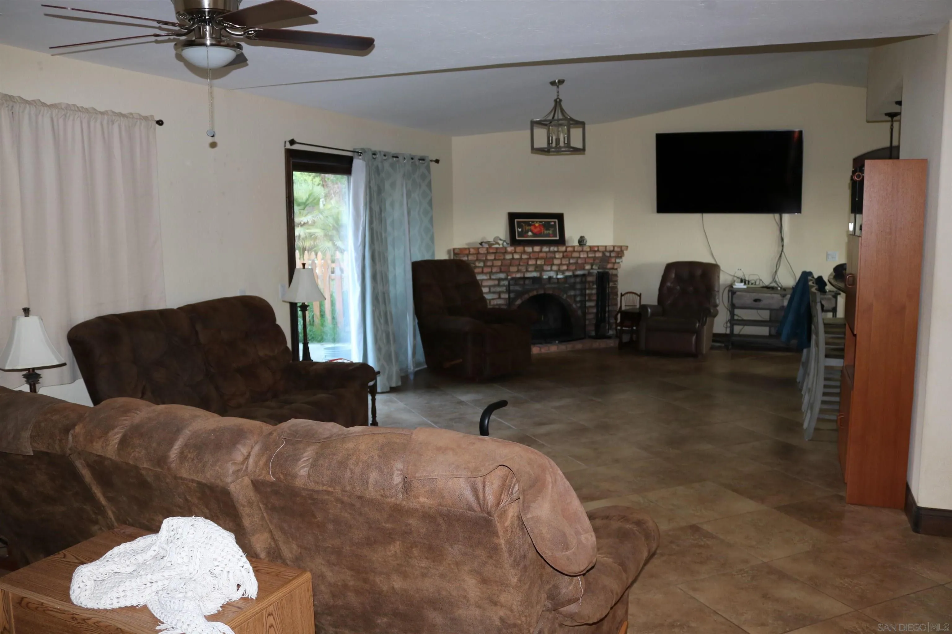 38083 De Luz Road Fallbrook, CA 92028 - Photo 7 of 29 a living room with furniture and a flat screen tv