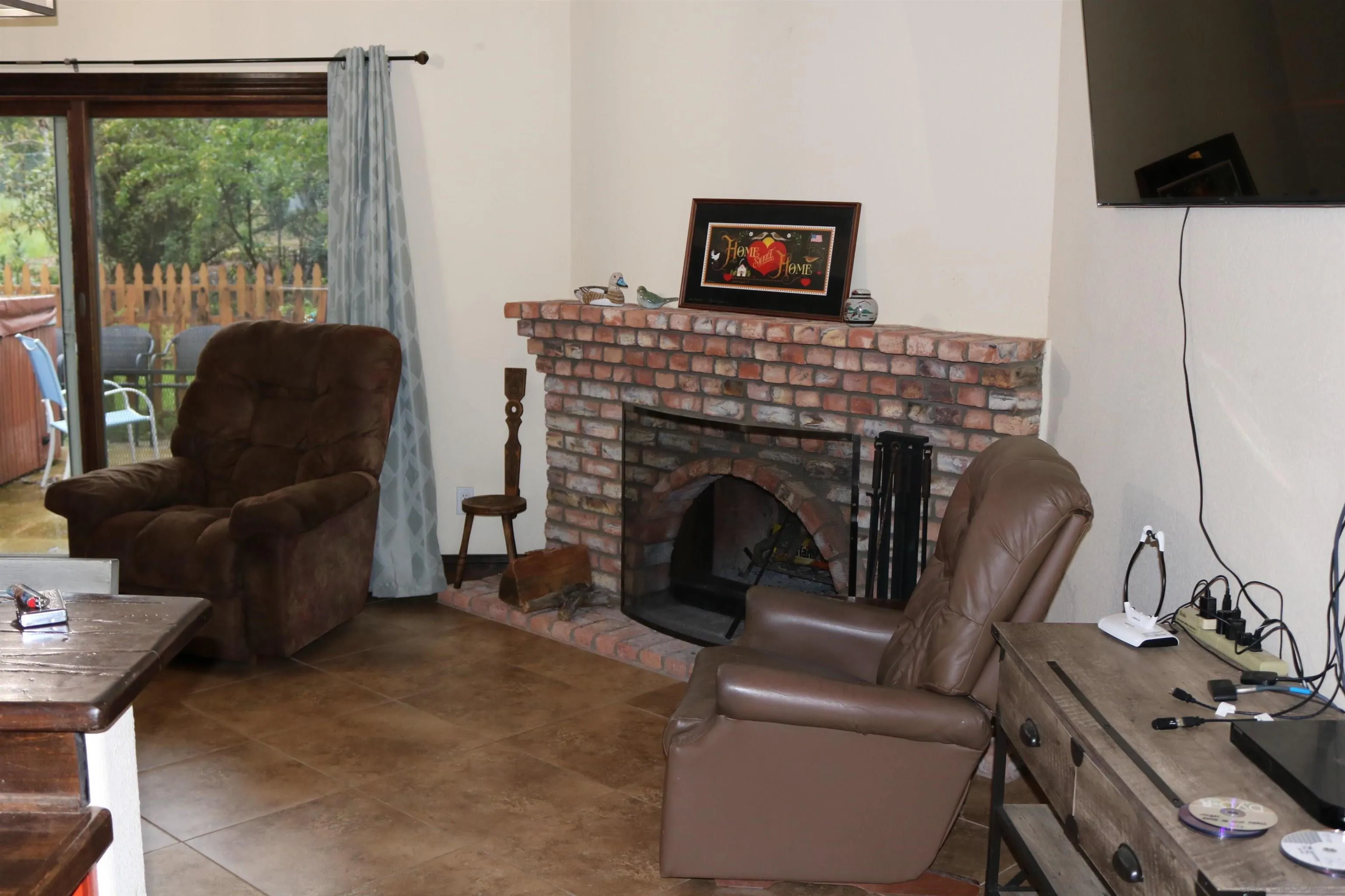 38083 De Luz Road Fallbrook, CA 92028 - Photo 8 of 29 a living room with furniture and a fireplace
