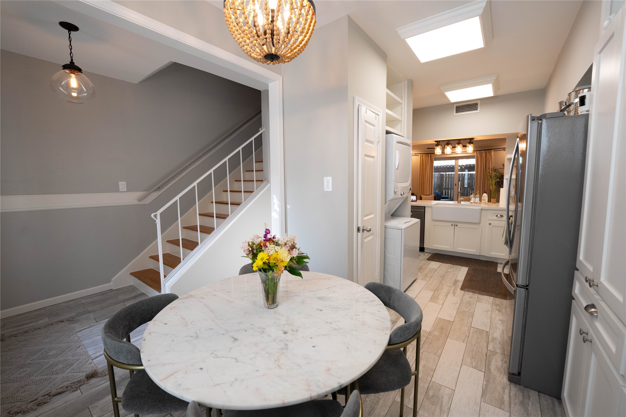 7447 Brompton Street, Unit 7447 Houston, TX 77025 - Photo 10 of 27 Charming eat-in kitchen featuring a sunny bay window and built-in bench seating.