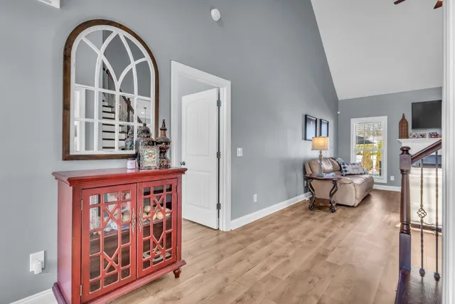 a bedroom with a bed couch and a window