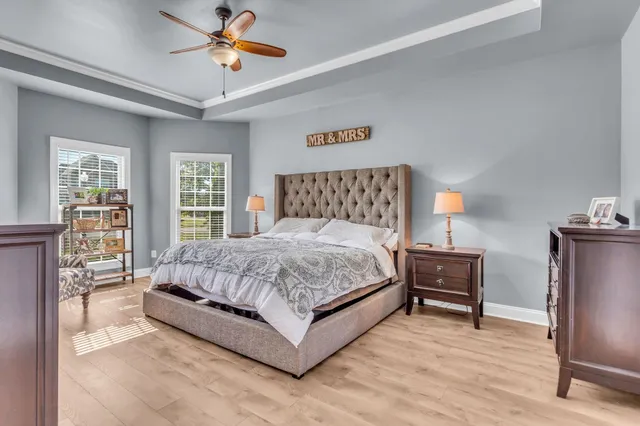 a bedroom with a bed and a lamp