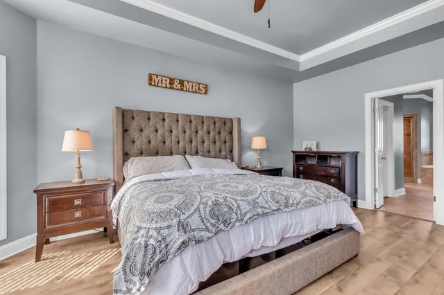 a bathroom with a tub shower and toilet