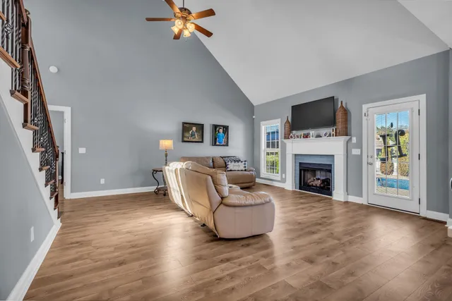 a kitchen with stainless steel appliances granite countertop a refrigerator a stove a sink dishwasher a oven with a dining table and chairs