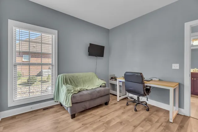 a bathroom with a toilet a sink and a mirror