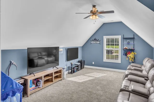 a view of swimming pool with outdoor seating and plants