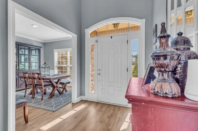 a view of a dining room with furniture and a window