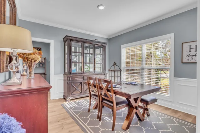 a dining room with furniture and window