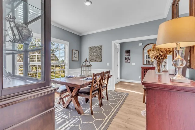 a view of a bedroom with furniture window and wooden floor