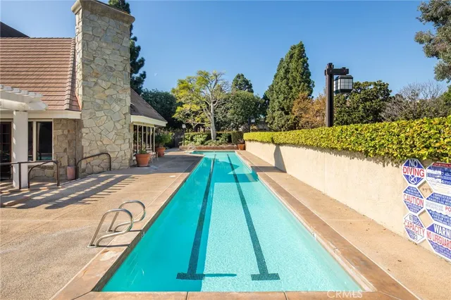 a view of swimming pool with lounge chair