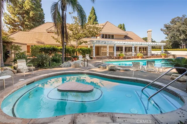 a view of a swimming pool with a patio