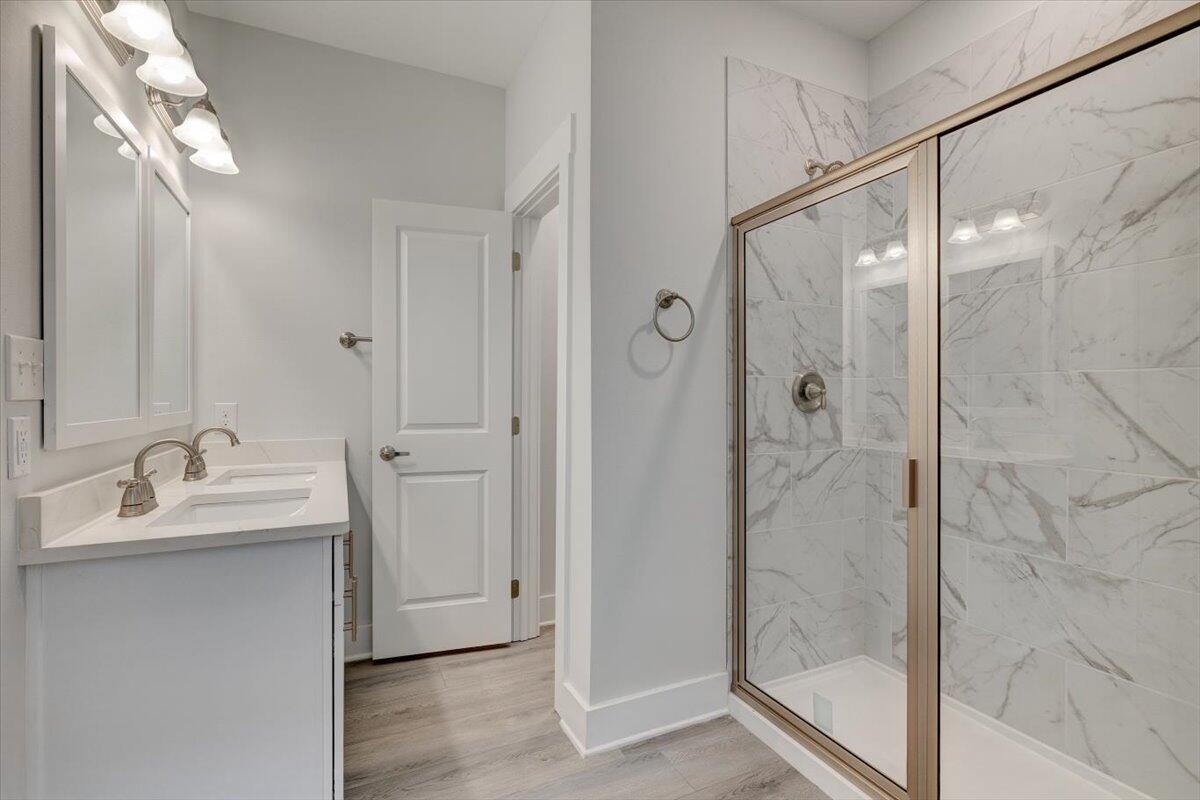 14 Alexander Way Freeport, FL 32439 - Photo 11 of 25 a bathroom with a double vanity sink mirror and shower
