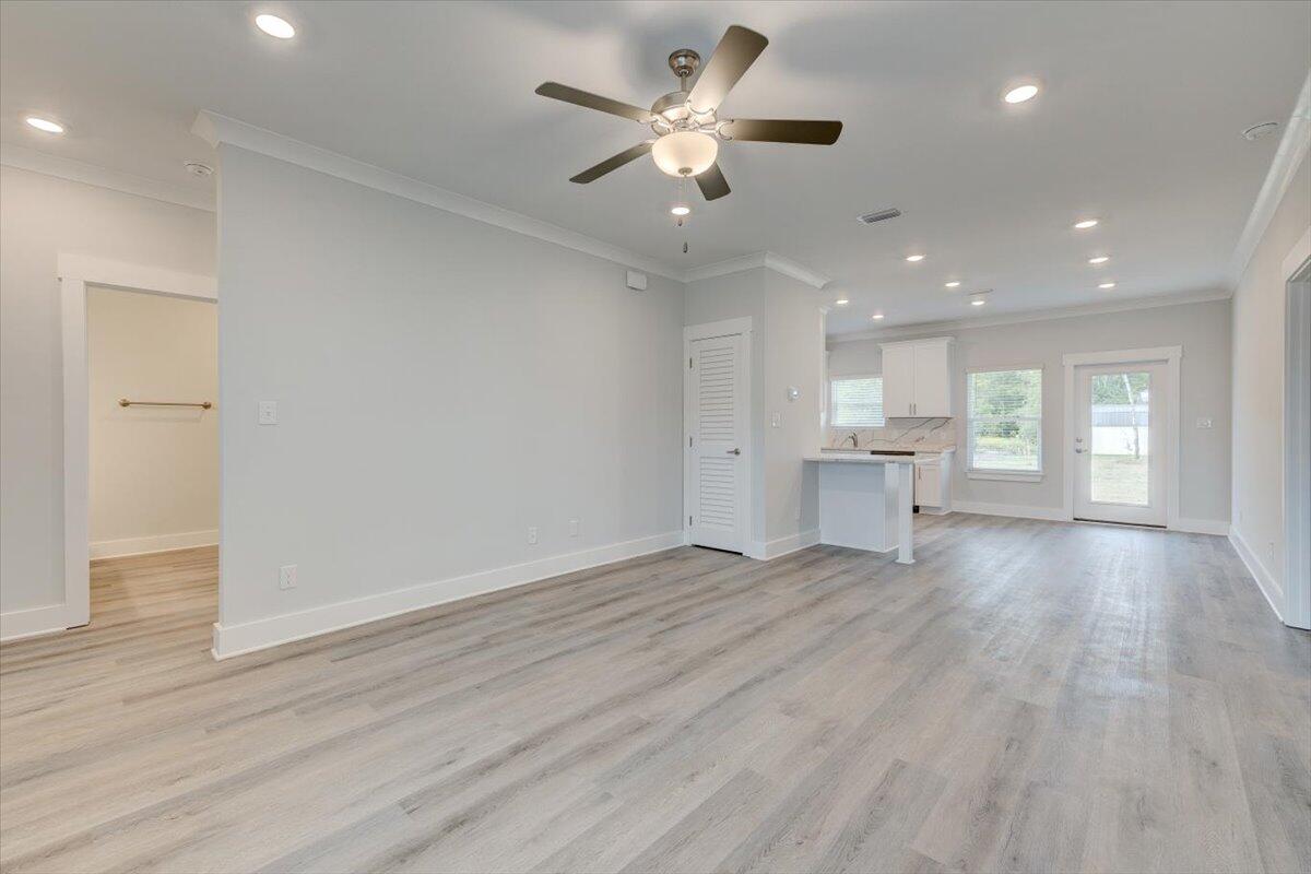 14 Alexander Way Freeport, FL 32439 - Photo 2 of 25 a view of an empty room and a kitchen