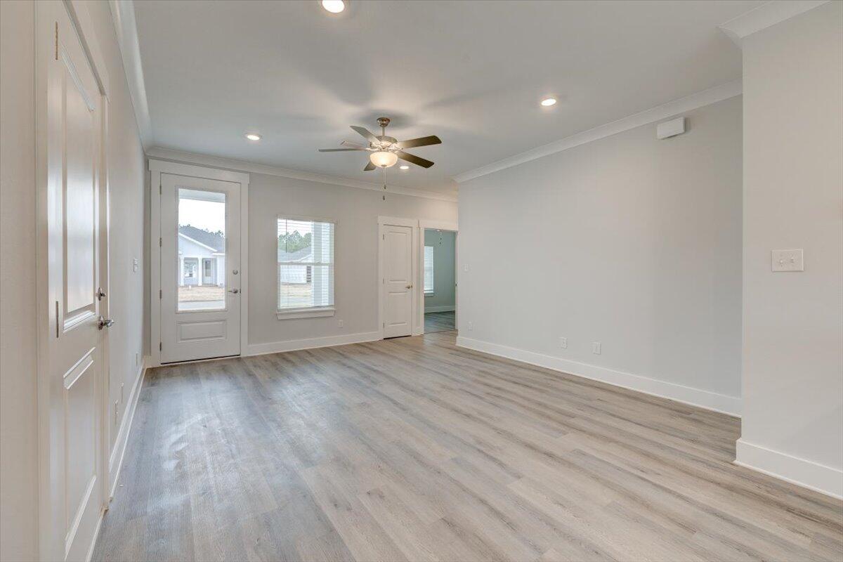 14 Alexander Way Freeport, FL 32439 - Photo 3 of 25 wooden floor in an empty room with a window