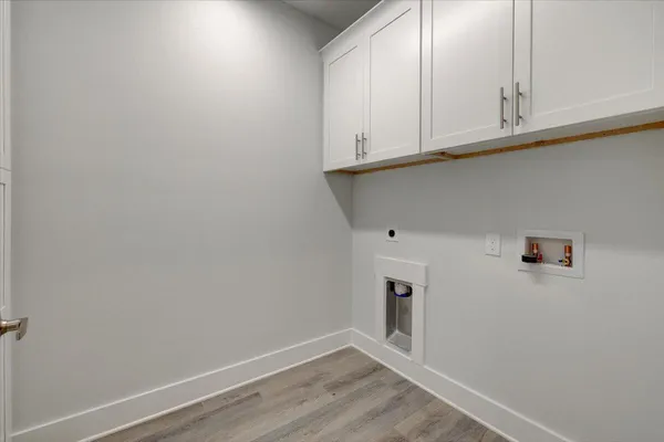 a view of cabinets and wooden floor