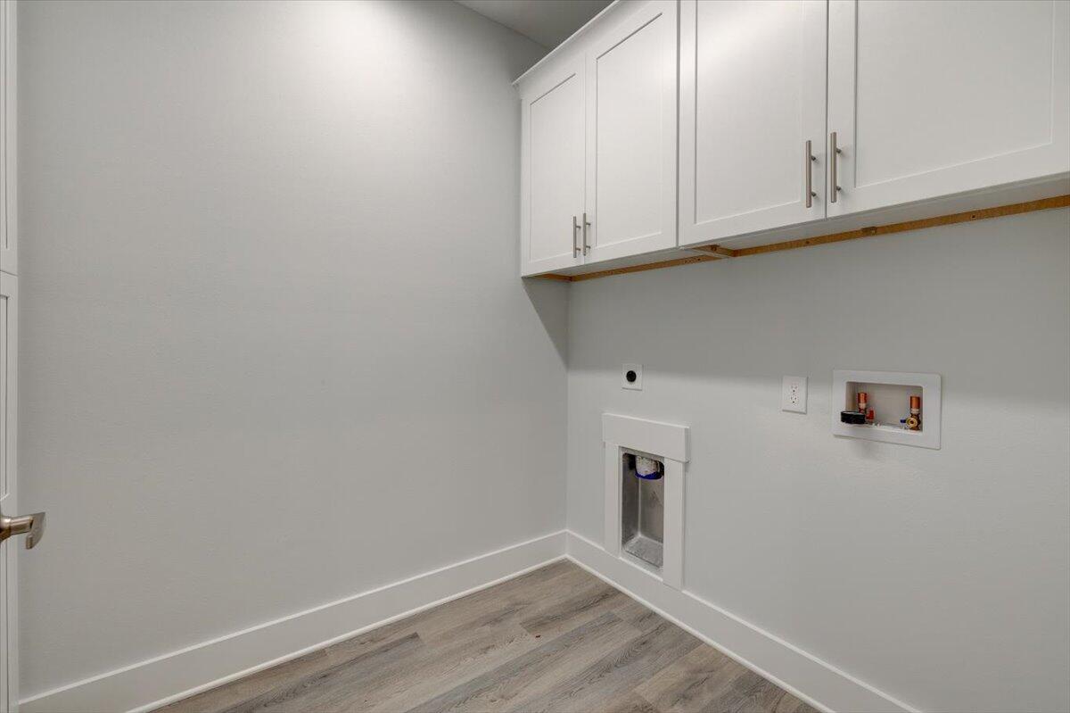 14 Alexander Way Freeport, FL 32439 - Photo 7 of 25 a view of cabinets and wooden floor