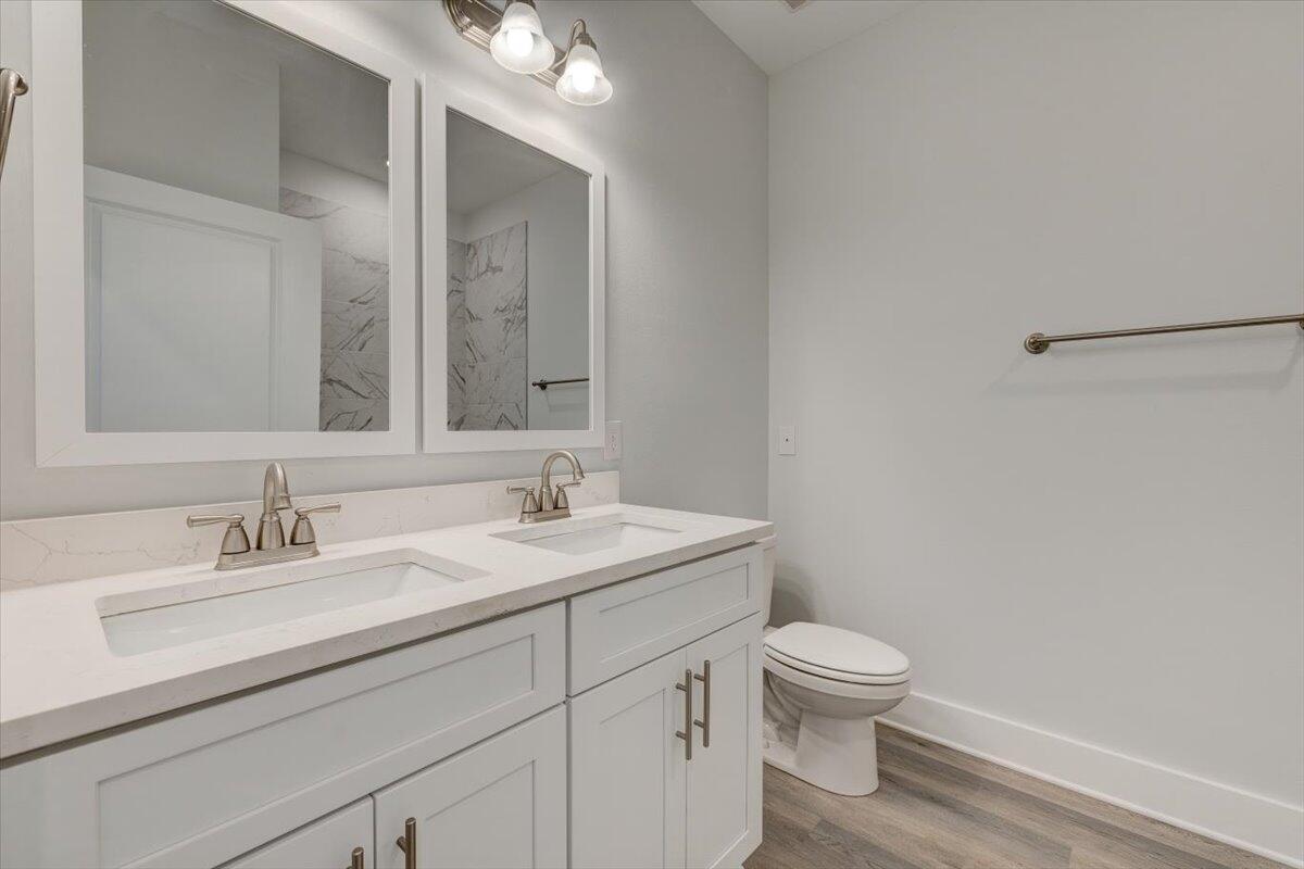 14 Alexander Way Freeport, FL 32439 - Photo 8 of 25 a bathroom with a toilet a sink and mirror