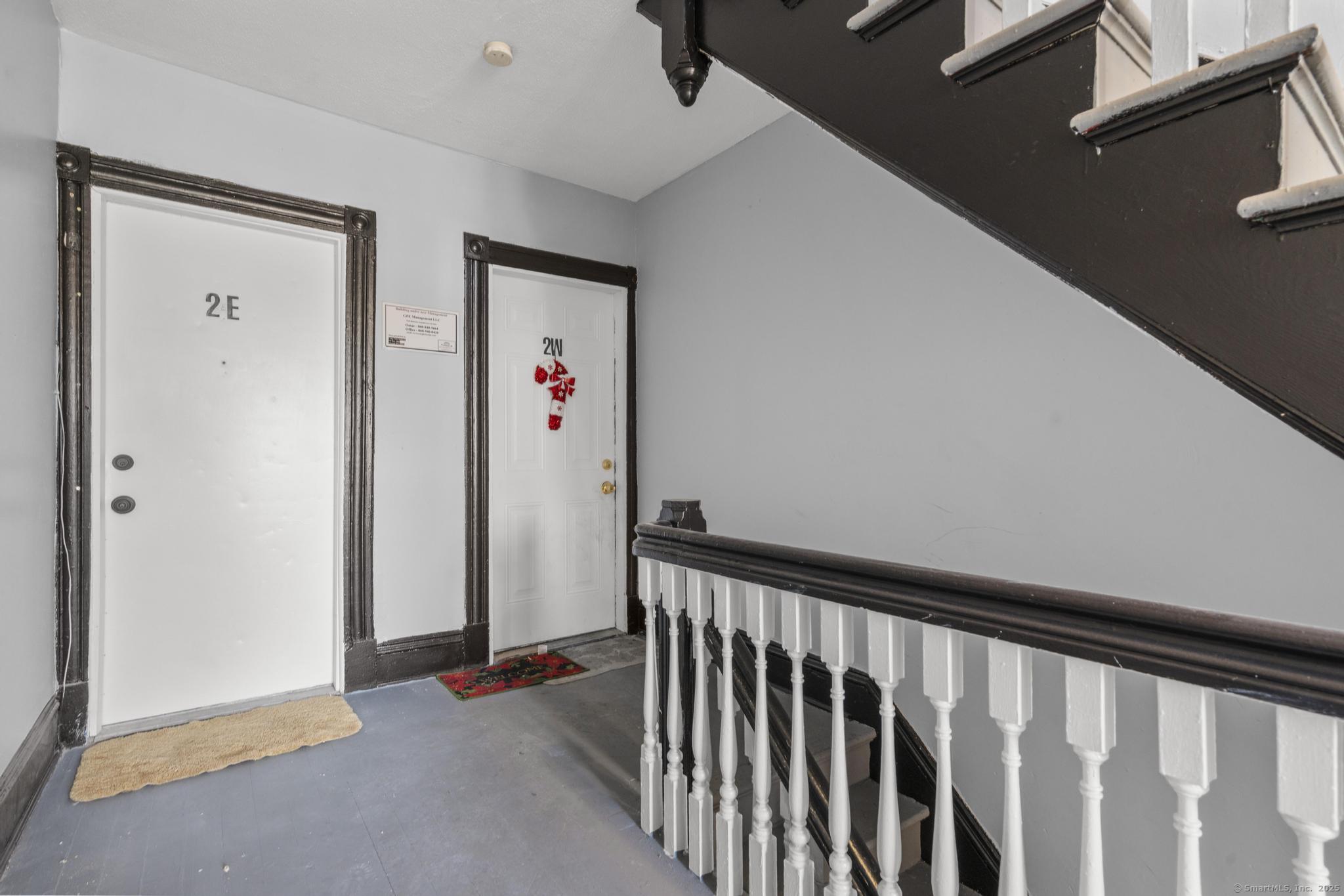19 Whitmore Street Hartford, CT 06114 - Photo 22 of 27 a view of a hallway with wooden floor and closet