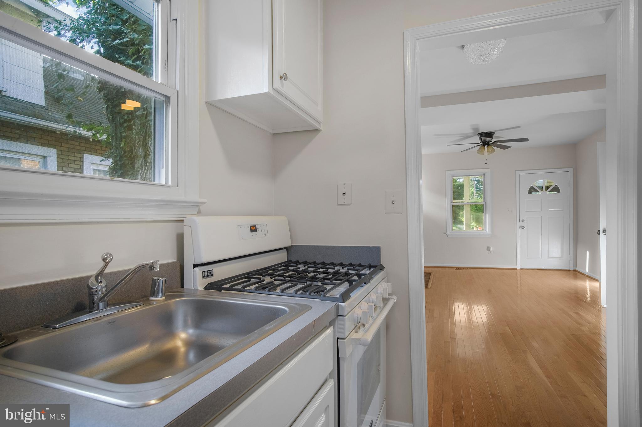 217 Peabody Street Northwest Washington, DC 20011 - Photo 14 of 27 a kitchen with a sink and cabinets