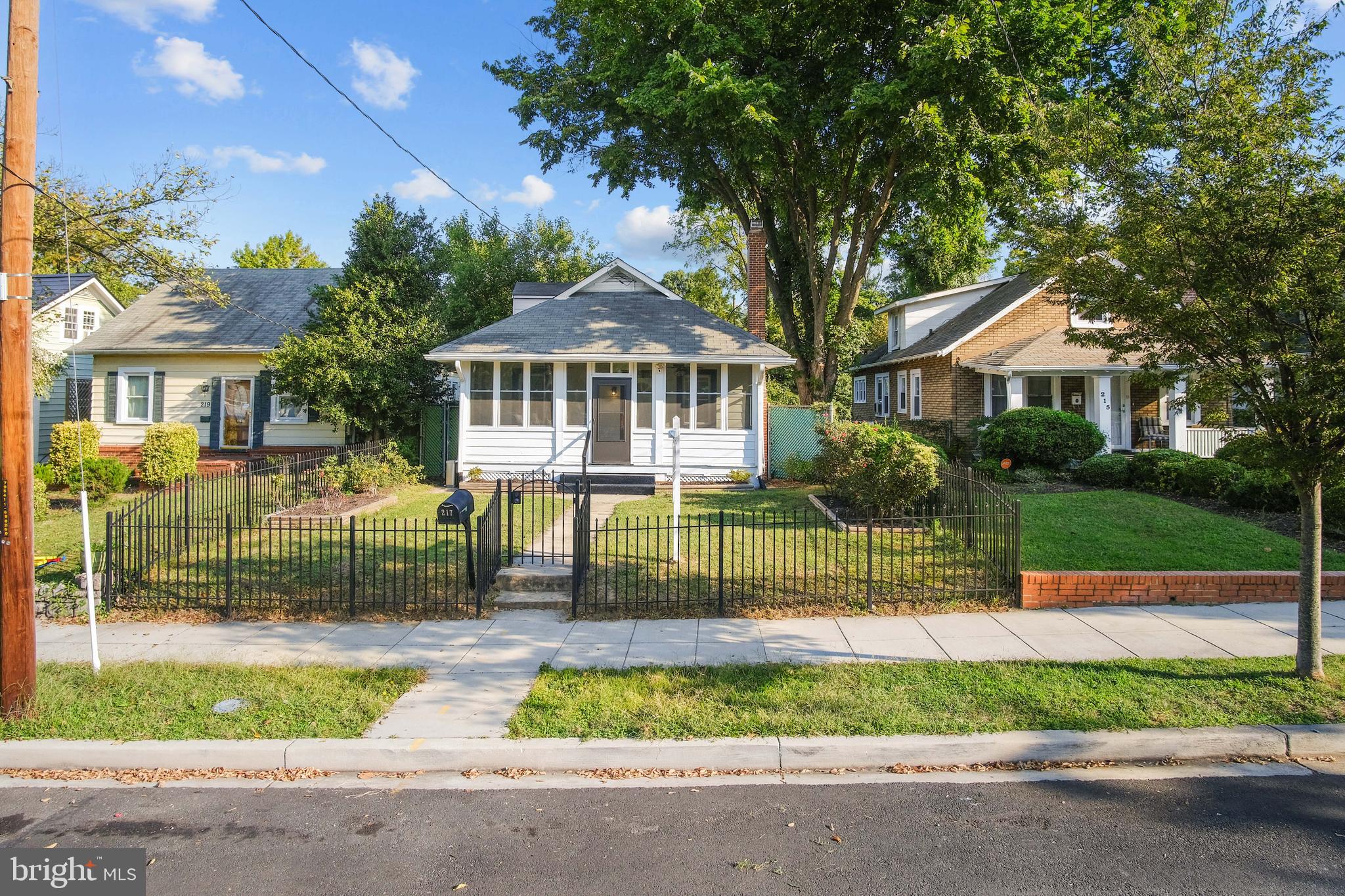 217 Peabody Street Northwest Washington, DC 20011 - Photo 4 of 27 a front view of a house with a yard