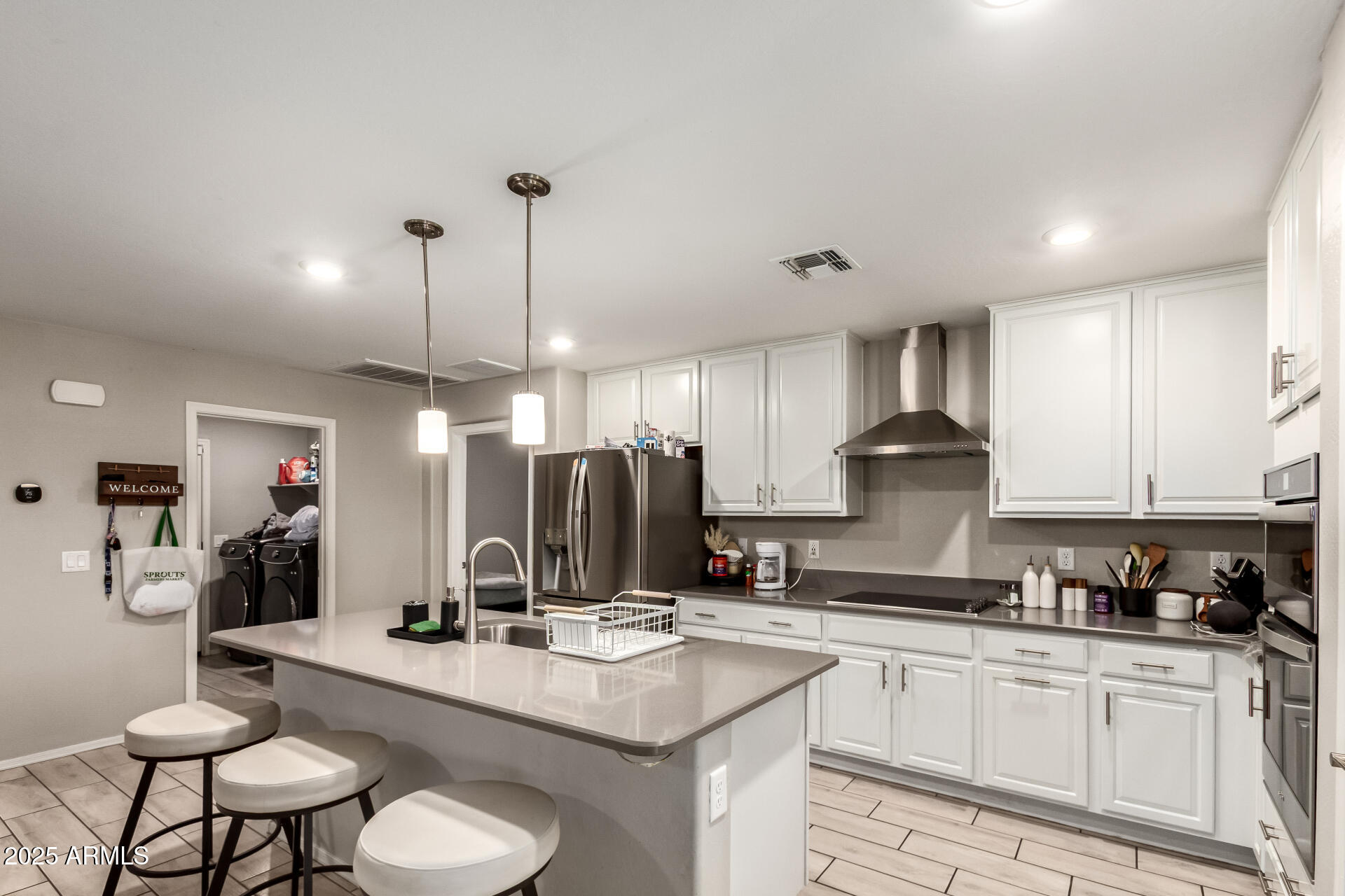 1133 South Rico Mesa, AZ 85204 - Photo 12 of 36 a kitchen with stainless steel appliances kitchen island granite countertop a sink a stove a refrigerator and chairs