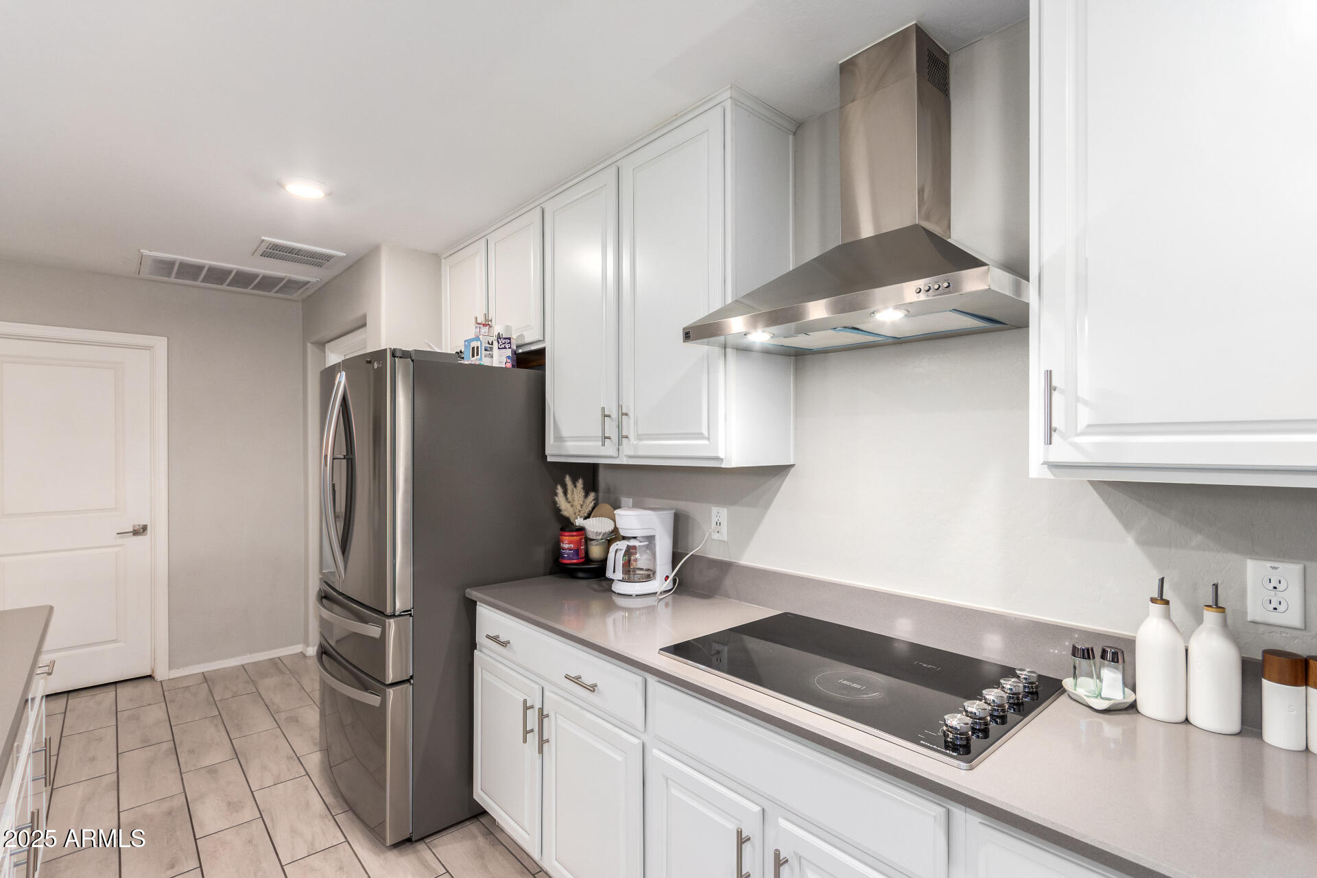 1133 South Rico Mesa, AZ 85204 - Photo 13 of 36 a kitchen with stainless steel appliances granite countertop a sink stove and refrigerator