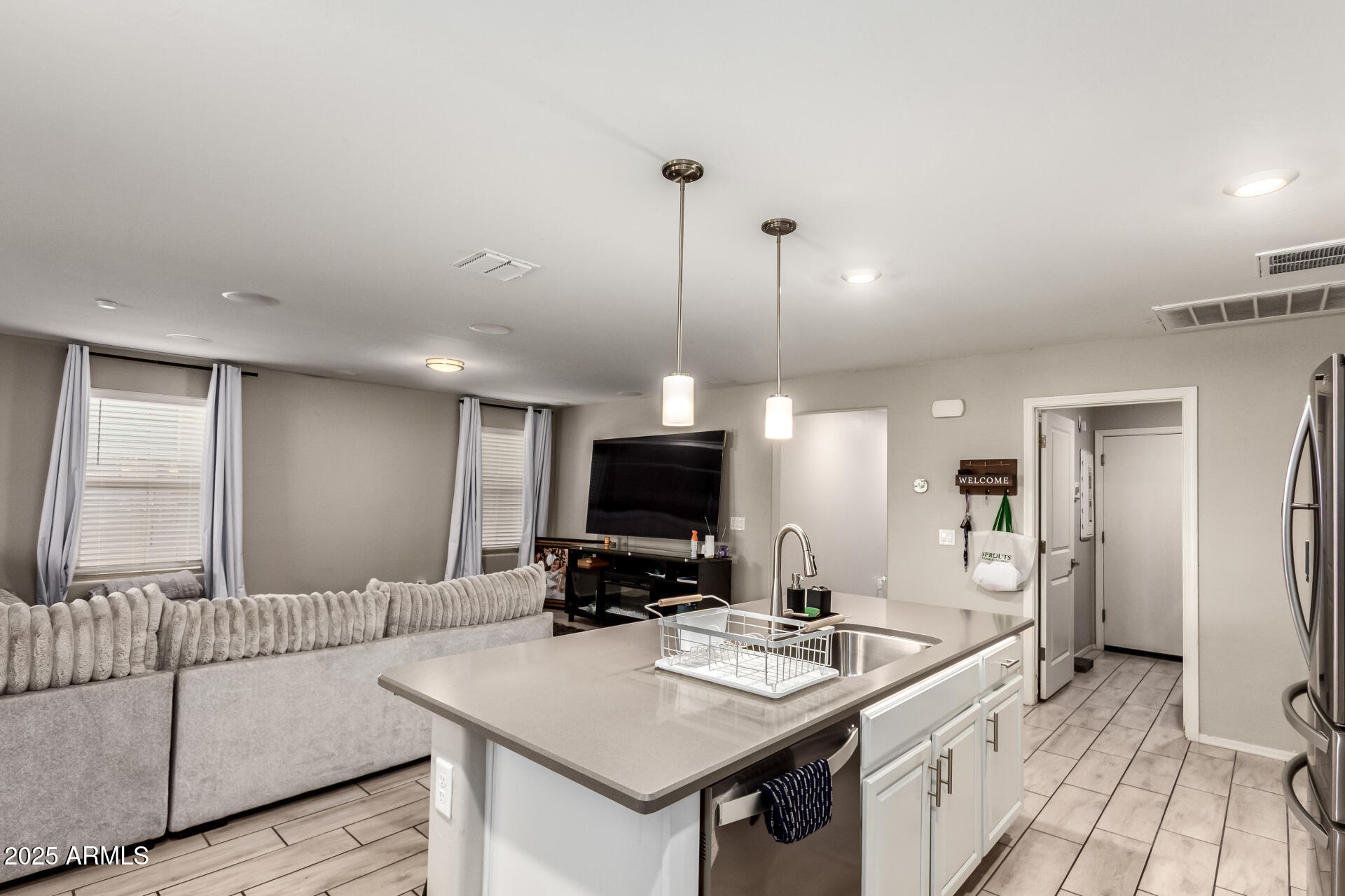 1133 South Rico Mesa, AZ 85204 - Photo 14 of 36 a living room with furniture and a flat screen tv