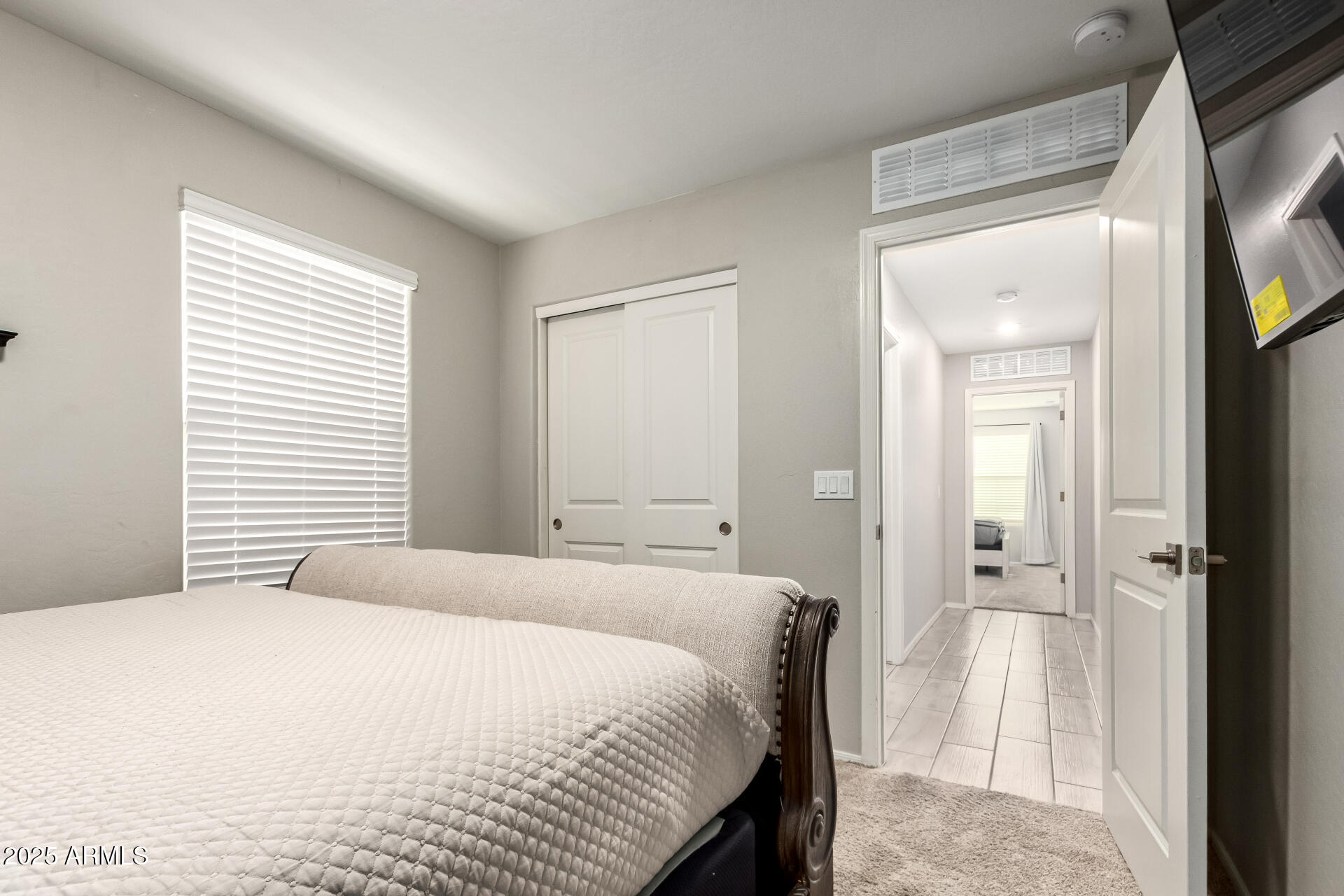 1133 South Rico Mesa, AZ 85204 - Photo 22 of 36 a bedroom with a bed and a mirror