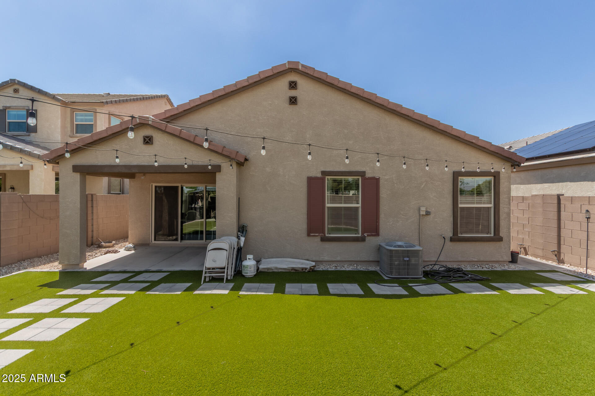 1133 South Rico Mesa, AZ 85204 - Photo 35 of 36 a front view of house with yard outdoor seating and garage