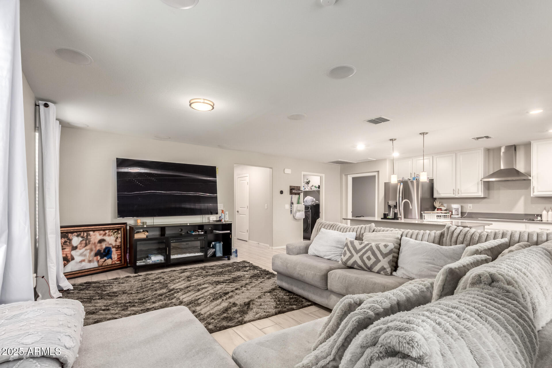 1133 South Rico Mesa, AZ 85204 - Photo 10 of 36 a living room with furniture and a flat screen tv