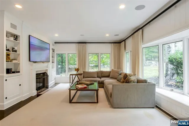 a living room with furniture and a fireplace