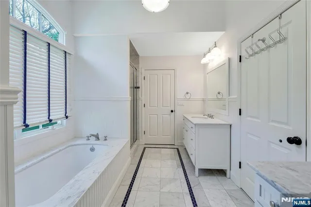 a bathroom with a bathtub and a sink