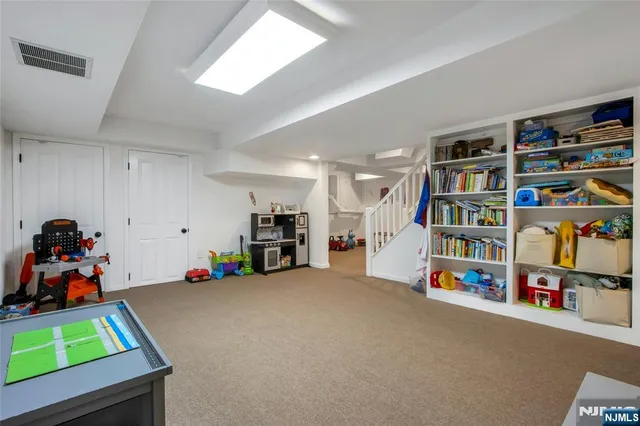 a view of play room with toys and toys