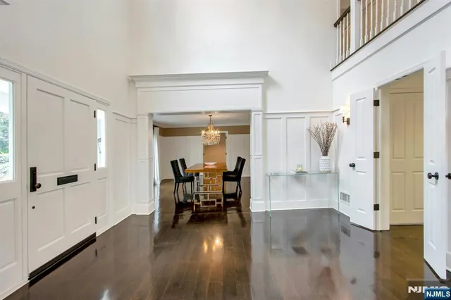a view of a livingroom with furniture and hardwood floor