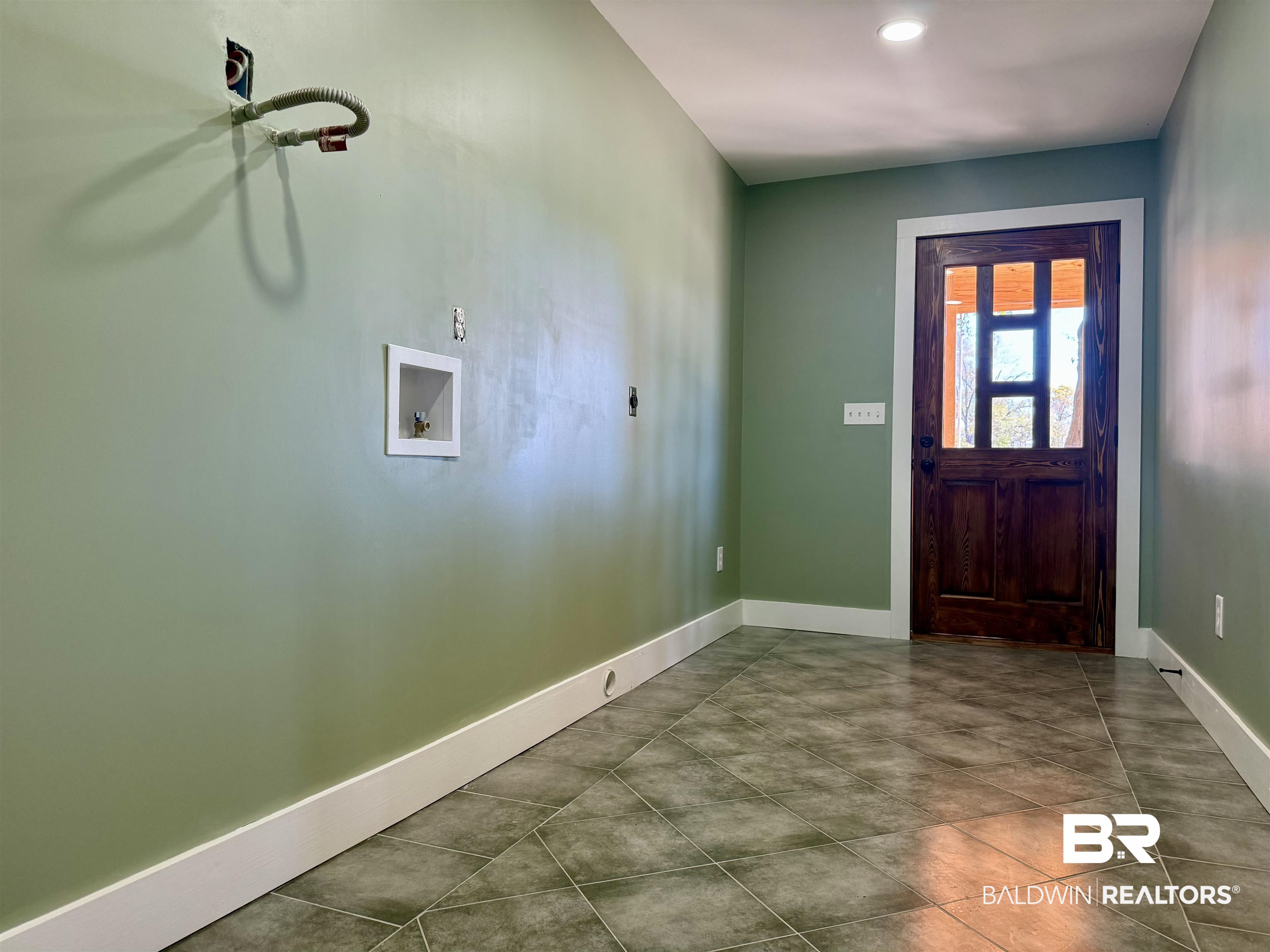 613 Forrest Avenue Brewton, AL 36426 - Photo 21 of 22 Entrance foyer with baseboards and tile patterned flooring