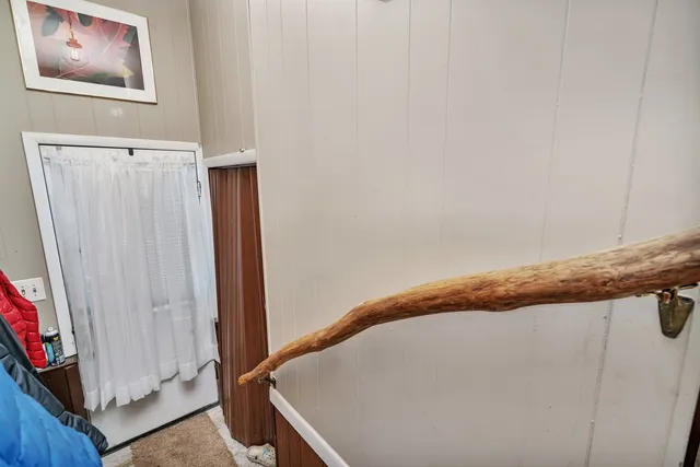 a view of a room with furniture and a gate