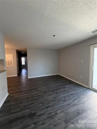 a view of a livingroom with wooden floor
