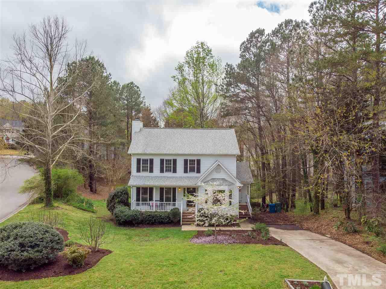 1 Swallows Ridge Court Durham, NC 27713 - Photo 2 of 26 a front view of a house with a garden and trees