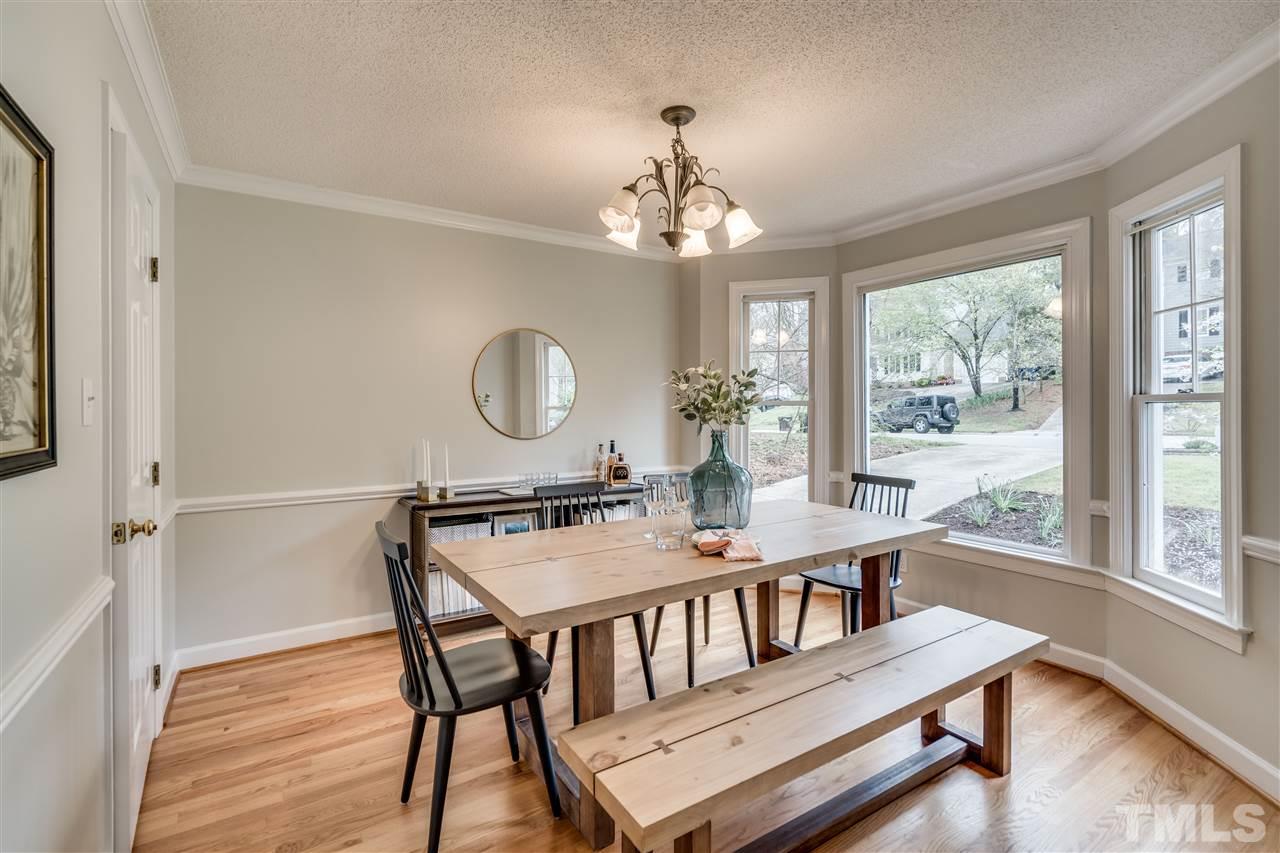 1 Swallows Ridge Court Durham, NC 27713 - Photo 11 of 26 a view of a dining room with furniture window and wooden floor