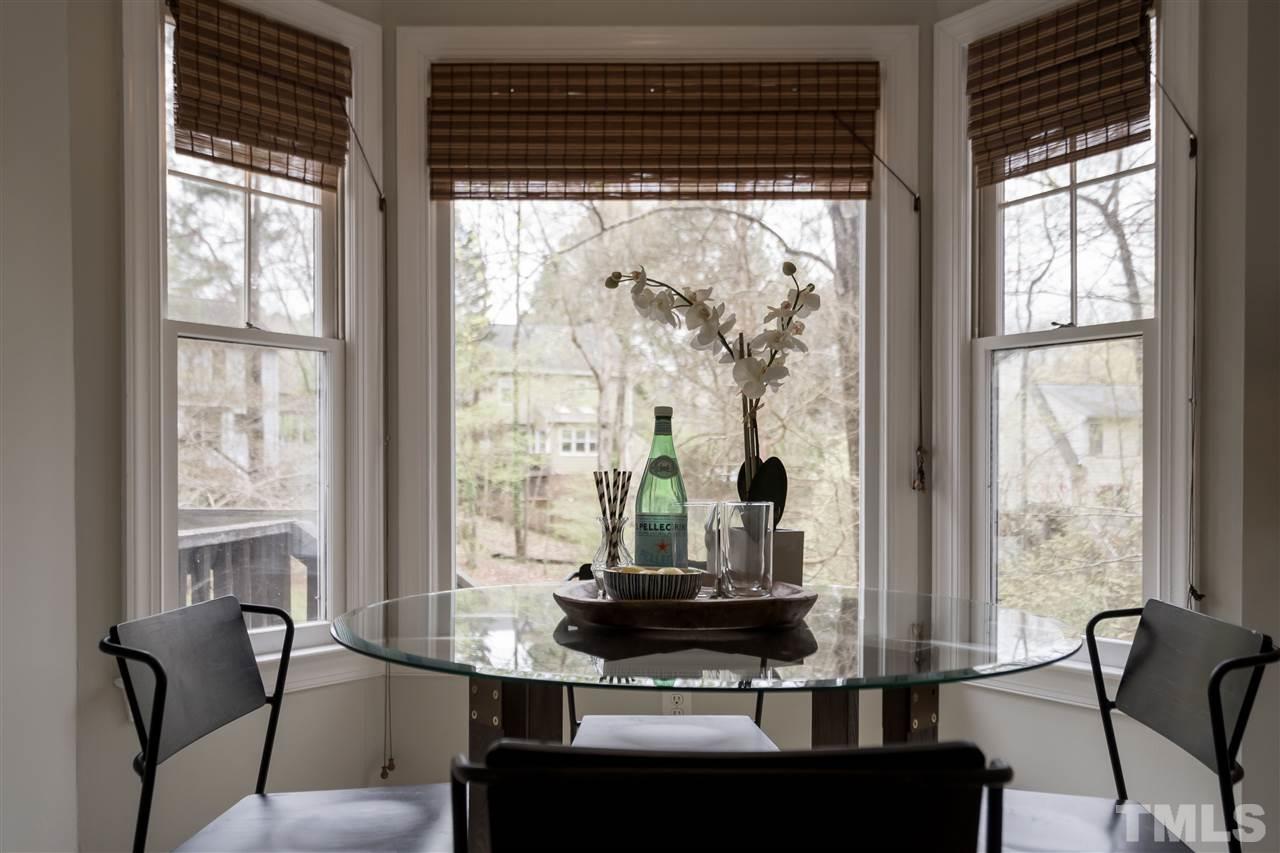 1 Swallows Ridge Court Durham, NC 27713 - Photo 16 of 26 a dining room with furniture and large windows