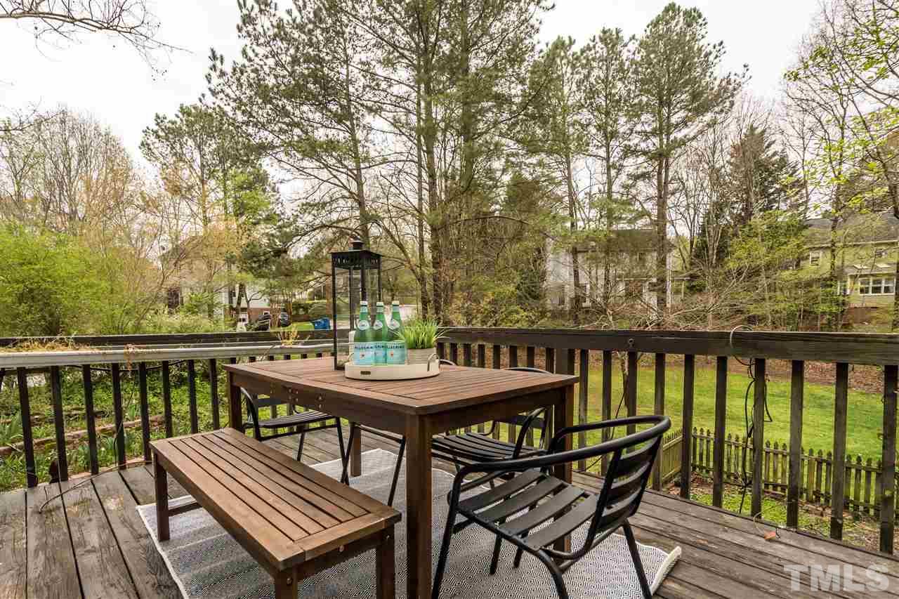 1 Swallows Ridge Court Durham, NC 27713 - Photo 20 of 26 a view of a balcony with wooden floor and outdoor seating