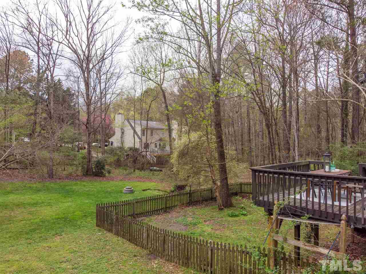 1 Swallows Ridge Court Durham, NC 27713 - Photo 21 of 26 a view of a deck with a yard