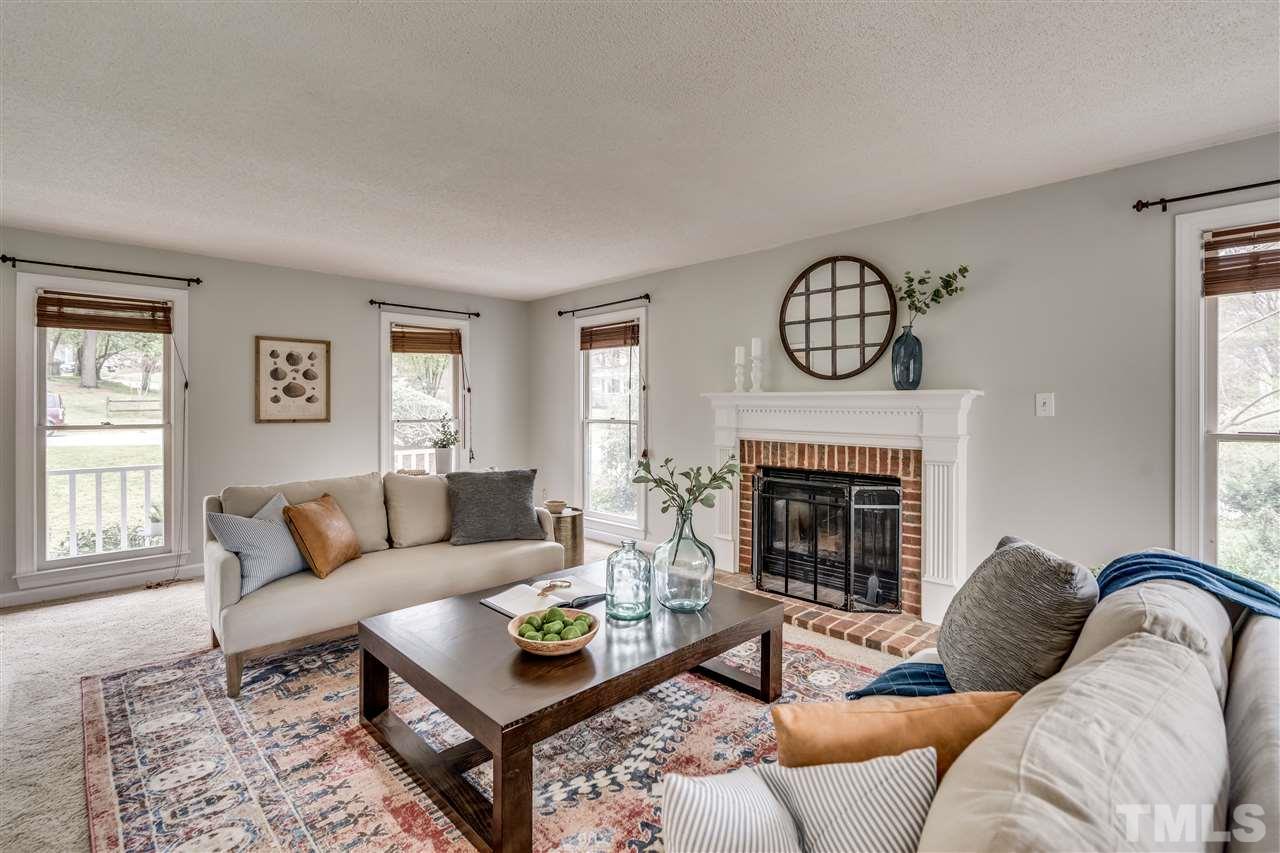 1 Swallows Ridge Court Durham, NC 27713 - Photo 7 of 26 a living room with furniture a fireplace and window