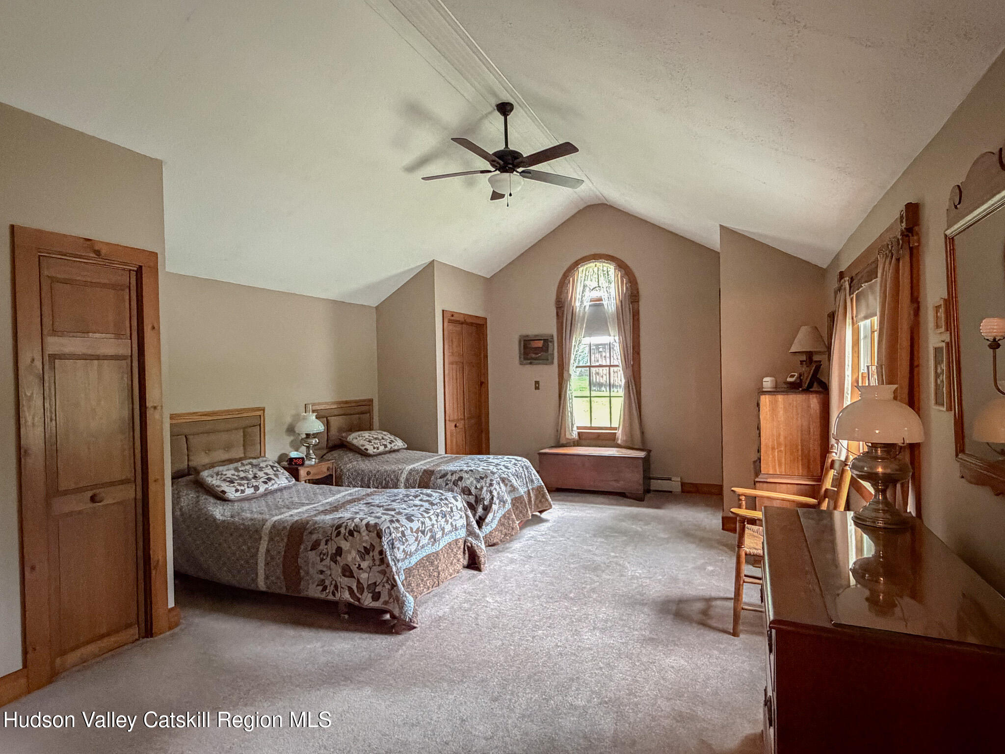 221 Camp Medusa Road Rensselaerville, NY 12120 - Photo 13 of 57 a bedroom with a bed a ceiling fan and a dresser